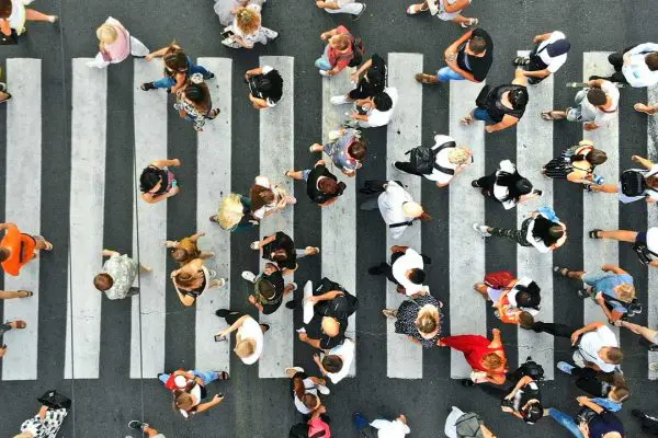 People walking across a pedestrian crossing
