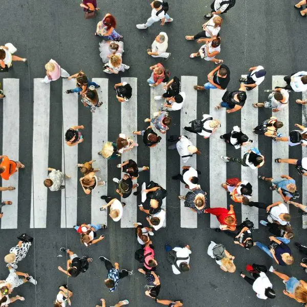 People walking across a pedestrian crossing